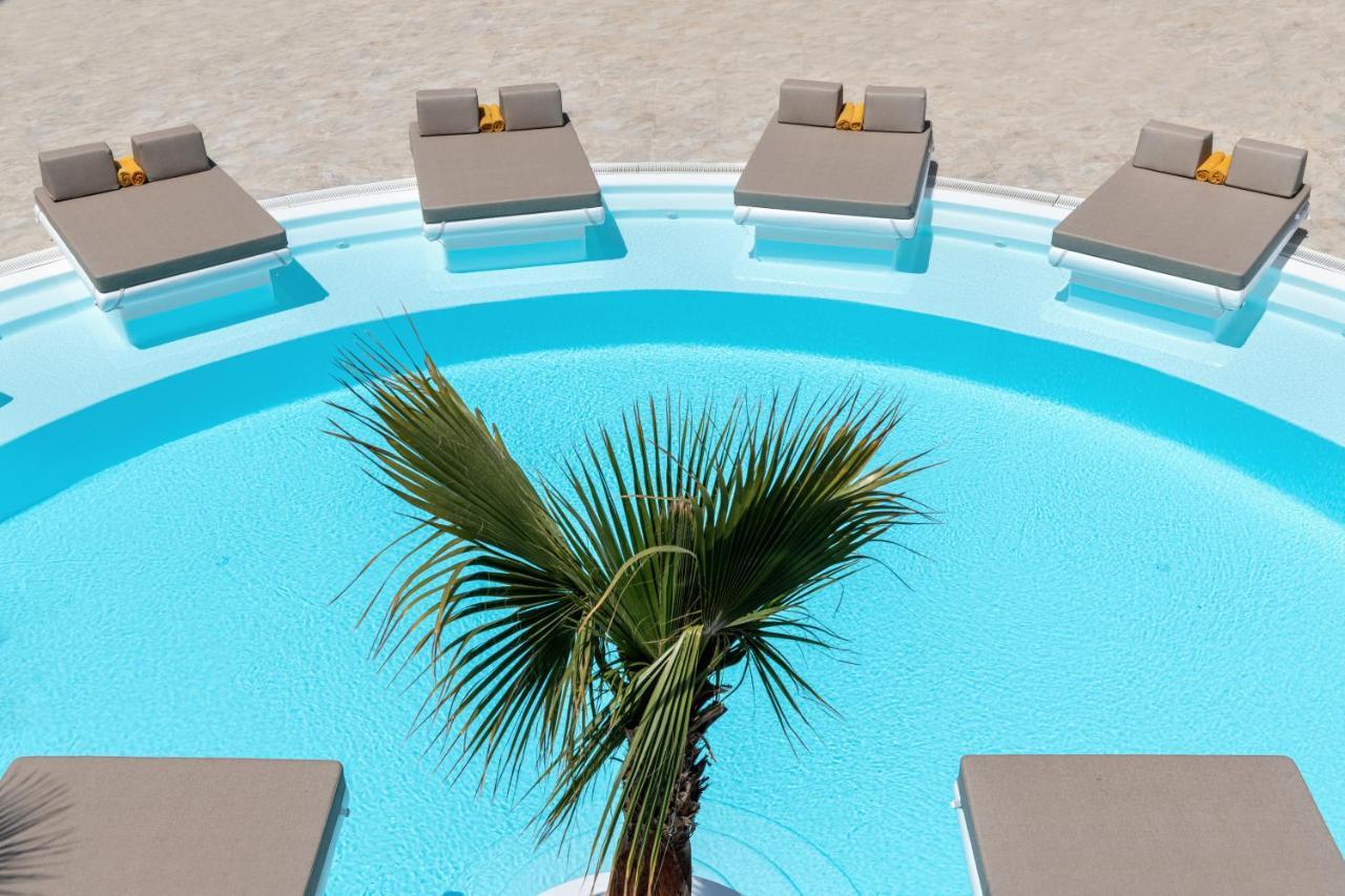Santorini Kastelli Resort Kamári Exterior foto A swimming pool